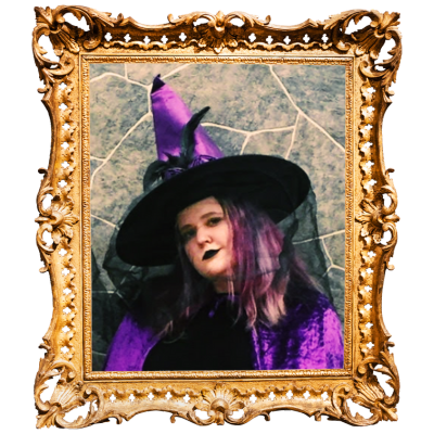 A photo of Sarah Wood, dressed as a witch in a purple costume, surrounded by an ornate gold frame.